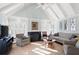 Bright living room features vaulted ceilings, fireplace, plantation shutters, and stylish decor at 255 Maple Nw Ave, Marietta, GA 30064