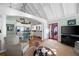 Bright living space connects to kitchen, featuring vaulted ceilings and access to outdoor patio at 255 Maple Nw Ave, Marietta, GA 30064