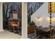 Beautiful outdoor space boasts a brick fireplace, dining set, and cozy seating, ideal for relaxation at 255 Maple Nw Ave, Marietta, GA 30064