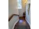 Staircase with hardwood steps, a painted stringer, and a wooden handrail at 255 Maple Nw Ave, Marietta, GA 30064