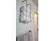 Clean bathroom with rolled white towels neatly displayed on a gold hanging rack at 361 17Th Nw St # 1610, Atlanta, GA 30363
