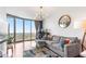 Cozy living room features a modern design with ample seating and stunning views from the large windows at 361 17Th Nw St # 1610, Atlanta, GA 30363
