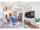 Open-concept living room with hardwood floors, a modern kitchen view, and a comfortable seating area at 361 17Th Nw St # 1610, Atlanta, GA 30363