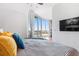 Comfortable main bedroom with a view and balcony access, showcasing modern interiors at 361 17Th Nw St # 1610, Atlanta, GA 30363