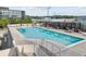 Upscale community pool with lounging area for residents in a modern building and urban surroundings at 361 17Th Nw St # 1610, Atlanta, GA 30363