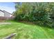 Large backyard with green grass and a view of mature trees at 3845 Alden Place, Cumming, GA 30028