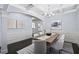 Formal dining room featuring a large table with seating for eight, coffered ceilings, and wainscoting at 3845 Alden Place, Cumming, GA 30028