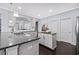 Elegant kitchen with granite countertops, white cabinets, and stainless steel appliances at 3845 Alden Place, Cumming, GA 30028