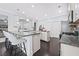 Well-lit kitchen with granite countertops, an island, and stainless steel appliances at 3845 Alden Place, Cumming, GA 30028