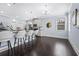 Stylish kitchen with an island, pendant lighting, and dark hardwood floors at 3845 Alden Place, Cumming, GA 30028