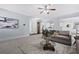 Bright living room featuring neutral walls, plush carpet, and modern decor at 3845 Alden Place, Cumming, GA 30028