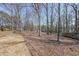 Expansive backyard featuring mature trees and ample space at 403 Flint Hill Ct, Lawrenceville, GA 30044