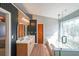 Modern bathroom with dual vanity, soaking tub, and sleek glass-enclosed shower at 403 Flint Hill Ct, Lawrenceville, GA 30044