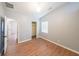 Neutral bedroom with wood-look flooring and a walk-in closet at 403 Flint Hill Ct, Lawrenceville, GA 30044