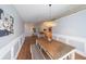 Bright dining room with a large wooden table, decor, and stylish modern lighting at 403 Flint Hill Ct, Lawrenceville, GA 30044