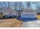 Charming single-story home featuring a two-car garage and well-manicured front yard at 403 Flint Hill Ct, Lawrenceville, GA 30044