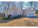 Charming single-story home featuring a two-car garage and well-manicured front yard at 403 Flint Hill Ct, Lawrenceville, GA 30044