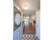 Inviting foyer with decorative tile and chandelier leading into an open-concept living space at 403 Flint Hill Ct, Lawrenceville, GA 30044