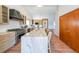 Large island with seating, and stainless appliances in renovated kitchen at 403 Flint Hill Ct, Lawrenceville, GA 30044