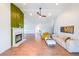 Bright living room featuring a fireplace and hardwood floors at 403 Flint Hill Ct, Lawrenceville, GA 30044