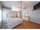 Bright main bedroom with vaulted ceilings, fan, and coordinated furniture at 403 Flint Hill Ct, Lawrenceville, GA 30044