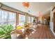 Sunroom with large windows, natural light, and seating area at 403 Flint Hill Ct, Lawrenceville, GA 30044