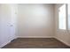 Bedroom with wood-look flooring, a large window, and neutral paint at 625 Egrets Landing #49, Covington, GA 30014