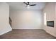 Open concept living room with wood-look flooring and a minimalist fireplace at 625 Egrets Landing #49, Covington, GA 30014