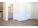 Spacious living room features neutral walls, light gray cabinets, and wood-look flooring at 625 Egrets Landing #49, Covington, GA 30014