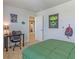 Bedroom with green comforter, small desk, and superhero themed decorations at 625 Egrets Landing #49, Covington, GA 30014