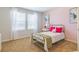 Pink bedroom with a metal bed frame, pink accents, and bright light at 625 Egrets Landing Lndg, Covington, GA 30014