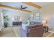 Cozy living room with wood beam accents, stylish decor, comfortable seating, and natural light at 625 Egrets Landing #49, Covington, GA 30014