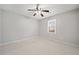 Bedroom with neutral carpet, ceiling fan, and large window that provides lots of natural light at 4358 Stockton Way, Marietta, GA 30066