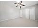 Bedroom showcasing neutral walls, ceiling fan and carpeting with double door closet at 4358 Stockton Way, Marietta, GA 30066