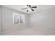 Bedroom with carpet, ceiling fan, a window and painted in a light neutral tone at 4358 Stockton Way, Marietta, GA 30066