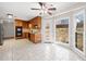 Well-lit kitchen with tile floors, wood cabinets, and a large window overlooking the backyard at 4358 Stockton Way, Marietta, GA 30066