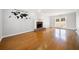 Bright living room featuring hardwood floors, a fireplace, and a view of the backyard at 4358 Stockton Way, Marietta, GA 30066