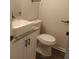 Bathroom with a modern square sink, granite counters, and black accents at 1 Willowick Dr, Lithonia, GA 30038