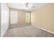 Bedroom with neutral carpet, a ceiling fan, and a double window at 2242 Longford Ne Ct, Marietta, GA 30066