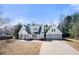 Charming two-story white home with a large driveway and a detached two-car garage at 2242 Longford Ne Ct, Marietta, GA 30066