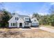 Beautiful two-story white home with well-manicured lawn, detached garage and long driveway at 2242 Longford Ne Ct, Marietta, GA 30066