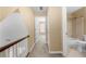 Upstairs hallway featuring carpet and an entrance into the bathroom at 2242 Longford Ne Ct, Marietta, GA 30066