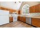 Bright kitchen with stainless steel appliances and white countertops at 2242 Longford Ne Ct, Marietta, GA 30066