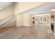 Bright open-concept living room showcasing a staircase, fireplace, and access to the kitchen and backyard at 2242 Longford Ne Ct, Marietta, GA 30066