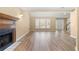 Spacious living room with large windows, a fireplace, and direct access to the foyer at 2242 Longford Ne Ct, Marietta, GA 30066