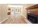 Open living room with a fireplace and access to a kitchen with stainless steel appliances at 2242 Longford Ne Ct, Marietta, GA 30066