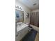 Cozy bathroom with a vanity, toilet, and shower/tub combination at 3129 Rock Pine Way, Snellville, GA 30078