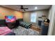 Cozy bedroom with two beds, a ceiling fan, wood floor, and a window for natural light at 3129 Rock Pine Way, Snellville, GA 30078