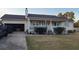Charming single-story home featuring a front porch, well-maintained lawn, and attached garage at 3129 Rock Pine Way, Snellville, GA 30078