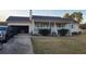 Charming single-story home featuring a front porch, well-maintained lawn, and attached garage at 3129 Rock Pine Way, Snellville, GA 30078